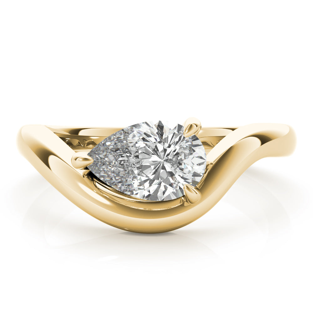 A pear-shaped diamond engagement ring set in a yellow gold  curved band